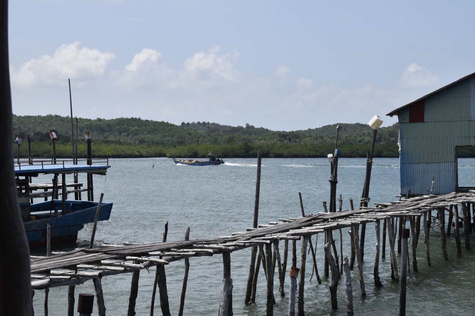 Stilt jetty and fishing boat, Batam